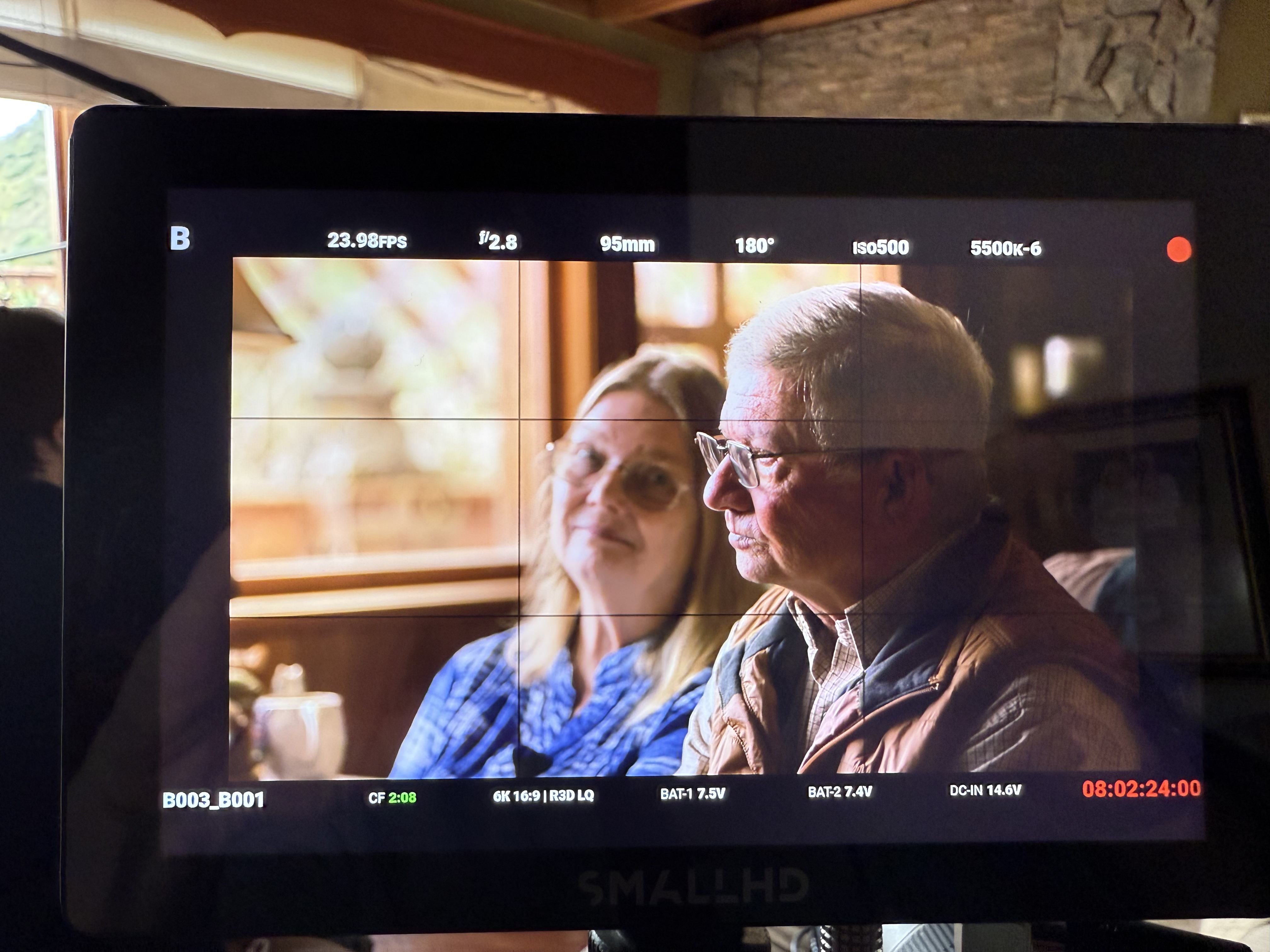 Steve and Carol looking through a viewfinder together